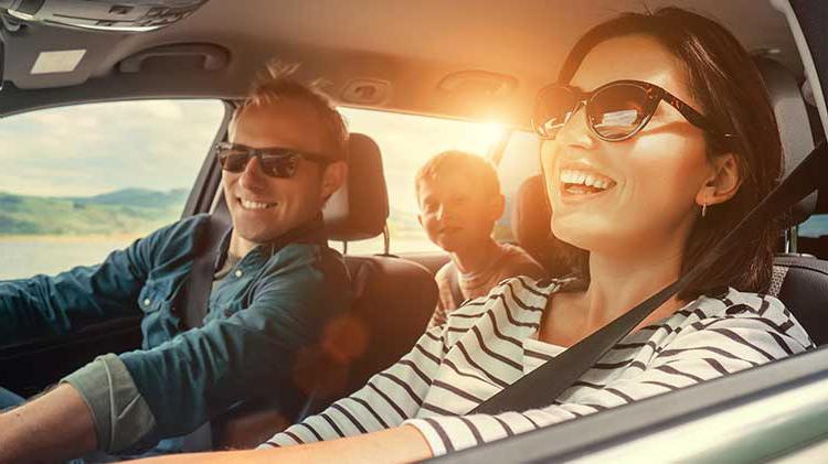 Happy family driving to Mexico while on vacation.